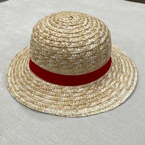 Straw hat with red ribbon